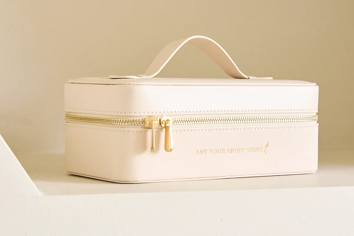 Estuche blanco Let Your Light Shine de Young Living con cremallera dorada