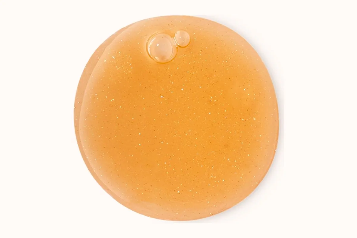 Textura del gel de ducha Aliento del Colibrí de Lush, dorada y con brillos